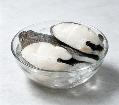 Delicate Seafood Delight: Freshly Sliced Fish Fillets